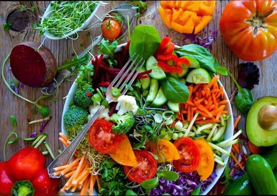 Top view of a loaded salad. 