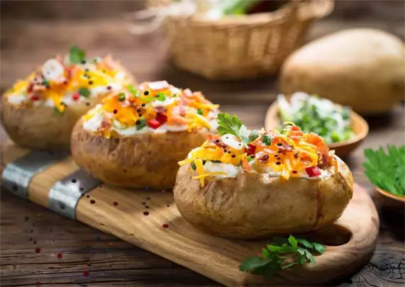 Giant homemade baked potatoes with delicious toppings. 