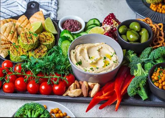 Delicious crudite platter of raw veggies, hummus, and high vibration foods.   