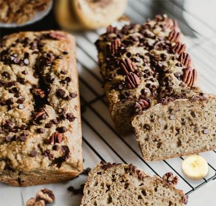 Loaded Himalayan Tartary Buckwheat banana bread loaves packed with chocolate chips, walnuts, and pecans. 