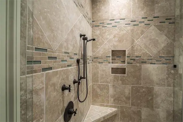 Inside view of spacious tiled shower. 