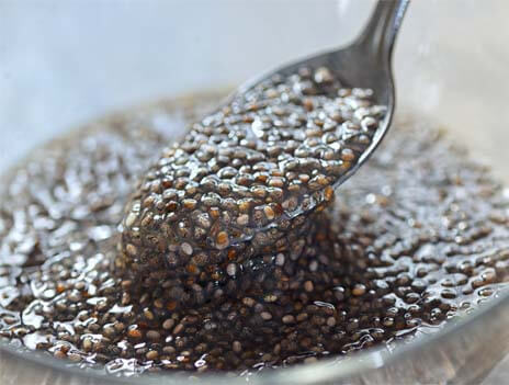 Close-up of a spoonful of chia egg made with chia seeds and pure water.  