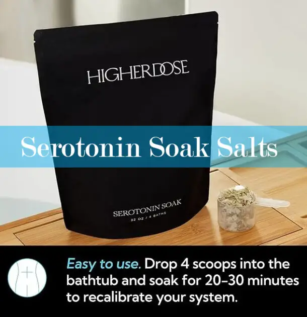 A clickable image showing a bag of Higher Dose Serotonin Soak Salts by a scoop of crystals on a bath caddy with instructions.  