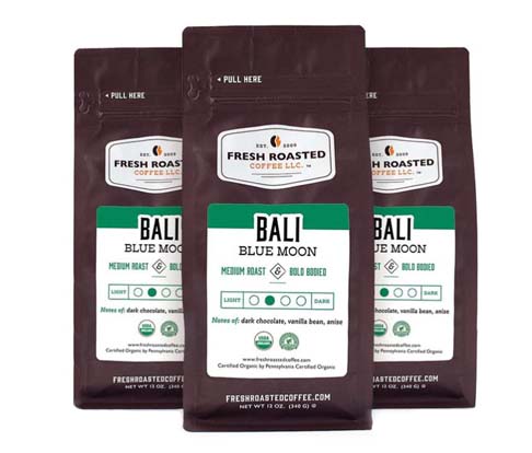 Clickable three-pack image of organic Bali Blue Moon coffee with dark chocolate, vanilla bean, and anise.   